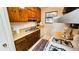 Simple kitchen with wood cabinets and gas range at 1906 Young Rd, Lithonia, GA 30058
