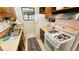 Small kitchen with wood cabinets and gas range at 1906 Young Rd, Lithonia, GA 30058