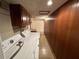 Basement laundry room with washer, dryer hookups, and cabinets at 1906 Young Rd, Lithonia, GA 30058