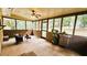 Spacious screened porch overlooking backyard with wooded views at 1906 Young Rd, Lithonia, GA 30058