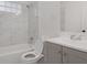 Bathroom featuring a shower over tub and white marble tile at 2046 Harold Se Ave, Smyrna, GA 30080