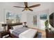 Well-lit bedroom features hardwood floors, ceiling fan, and private door to outside at 2046 Harold Se Ave, Smyrna, GA 30080