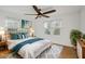 Cozy bedroom with large windows, ceiling fan, and a decorative rug at 2046 Harold Se Ave, Smyrna, GA 30080