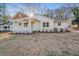 Charming home with a white picket fence and covered porch with sun shining through at 2046 Harold Se Ave, Smyrna, GA 30080