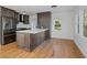 Modern kitchen features dark cabinets, stainless steel appliances, and hardwood floors at 2046 Harold Se Ave, Smyrna, GA 30080
