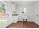 Bright laundry room with wood-look floors, utility sink, and exterior access at 2046 Harold Se Ave, Smyrna, GA 30080