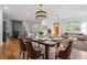 Open-concept living and dining area with hardwood floors and ample natural light at 2046 Harold Se Ave, Smyrna, GA 30080