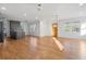 Open-concept living and dining area with hardwood floors and a front entry door at 2046 Harold Se Ave, Smyrna, GA 30080