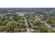 An aerial view showcases the property's location, surrounded by trees, and its proximity to the nearby town at 4293 Marietta St, Powder Springs, GA 30127