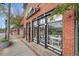 Commercial brick building with street-level storefronts, modern windows and signage at 4293 Marietta St, Powder Springs, GA 30127