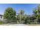 Gated community entrance with lush landscaping and an American flag waving in the breeze at 5200 Peachtree Rd # 3221, Chamblee, GA 30341