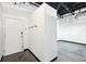 Modern entryway with coat hooks and concrete floors at 5200 Peachtree Rd # 3221, Chamblee, GA 30341