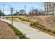 View of community area showing walking path and landscaping at 5200 Peachtree Rd # 3221, Chamblee, GA 30341