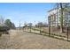 A view of the exterior community grounds featuring nice landscaping and fenced area at 5200 Peachtree Rd # 3221, Chamblee, GA 30341