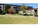 Well-maintained community grounds with lush green lawn, mature trees, and manicured landscaping at 5200 Peachtree Rd # 3221, Chamblee, GA 30341
