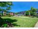 Manicured green lawn and mature trees surrounding the buildings at 5200 Peachtree Rd # 3221, Chamblee, GA 30341