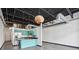 Modern kitchen features stainless steel appliances, granite countertops, and a stylish wood pendant light at 5200 Peachtree Rd # 3221, Chamblee, GA 30341