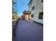 Spacious back deck with built-in lighting and stairs leading to a patio at 2308 Hanover Woods Rd, Lithonia, GA 30058