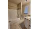 Clean bathroom with tub, shower, and granite countertop at 2308 Hanover Woods Rd, Lithonia, GA 30058