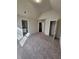 Well-lit bedroom with carpet flooring and en-suite bathroom at 2308 Hanover Woods Rd, Lithonia, GA 30058