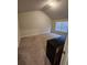 Spacious bedroom with vaulted ceiling and carpet flooring at 2308 Hanover Woods Rd, Lithonia, GA 30058