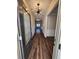 Bright entryway with dark hardwood floors and a chandelier at 2308 Hanover Woods Rd, Lithonia, GA 30058