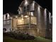 House exterior at night, showing lights and landscaping at 2308 Hanover Woods Rd, Lithonia, GA 30058