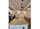 Kitchen island with granite countertop and double sink at 2308 Hanover Woods Rd, Lithonia, GA 30058