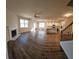 Open living room with hardwood floors, fireplace, and kitchen island at 2308 Hanover Woods Rd, Lithonia, GA 30058