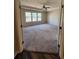Spacious main bedroom with carpeted floor and large windows at 2308 Hanover Woods Rd, Lithonia, GA 30058
