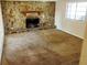 Living room with stone fireplace and carpet at 5801 Macedin Dr, Douglasville, GA 30135