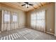 Bedroom with carpet, three windows, and a ceiling fan at 100 Pine Sandy Bank Dr, Canton, GA 30114