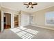 Bright bedroom with natural light, ceiling fan, and closet at 100 Pine Sandy Bank Dr, Canton, GA 30114