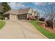 Exterior view of home featuring a three-car garage and concrete driveway at 100 Pine Sandy Bank Dr, Canton, GA 30114