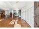 Bright foyer featuring hardwood floors, white wainscoting, and an open staircase at 100 Pine Sandy Bank Dr, Canton, GA 30114