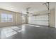 Spacious two-car garage featuring sealed floors and natural light from a large window at 100 Pine Sandy Bank Dr, Canton, GA 30114