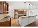 Well-lit kitchen with stainless steel appliances, island with seating, and ample cabinet space at 100 Pine Sandy Bank Dr, Canton, GA 30114