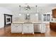 Bright kitchen with granite counters, stainless steel appliances, and a fireplace at 100 Pine Sandy Bank Dr, Canton, GA 30114