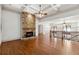 Open-concept living room with a stone fireplace at 100 Pine Sandy Bank Dr, Canton, GA 30114