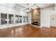 Living room with a stone fireplace and a ceiling fan at 100 Pine Sandy Bank Dr, Canton, GA 30114