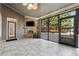 Screened porch with a stone fireplace and outdoor seating area at 100 Pine Sandy Bank Dr, Canton, GA 30114