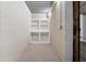Dedicated storage room with built-in shelving and carpeted floor at 100 Pine Sandy Bank Dr, Canton, GA 30114