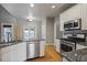 Spacious kitchen with island, stainless steel appliances, and granite countertops at 1278 Crown Ter, Marietta, GA 30062