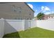 Fenced in backyard with well manicured fake grass at 2657 Avanti Way, Decatur, GA 30035