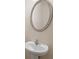 Bathroom features white sink and oval mirror at 2657 Avanti Way, Decatur, GA 30035