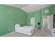 Bedroom features a white bed, carpet floor, and two open doors at 2657 Avanti Way, Decatur, GA 30035