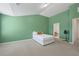 Bedroom with bed, carpet, and adjoining bathroom at 2657 Avanti Way, Decatur, GA 30035
