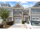 Charming townhome featuring a one-car garage, neutral exterior colors, and well-maintained landscaping at 2657 Avanti Way, Decatur, GA 30035