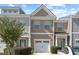 Inviting townhome showcases a one-car garage, attractive exterior, and tidy landscaping at 2657 Avanti Way, Decatur, GA 30035