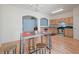 Open kitchen and dining room features wood floors and stainless steel appliances at 2657 Avanti Way, Decatur, GA 30035